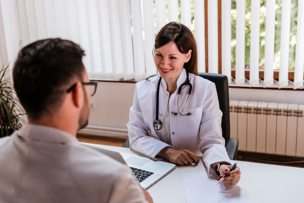 Female doctor talking to hospital administrator
