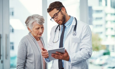 male doctor with female patient in hospital