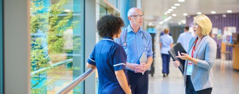 new healthcare job with doctors speaking in hallway
