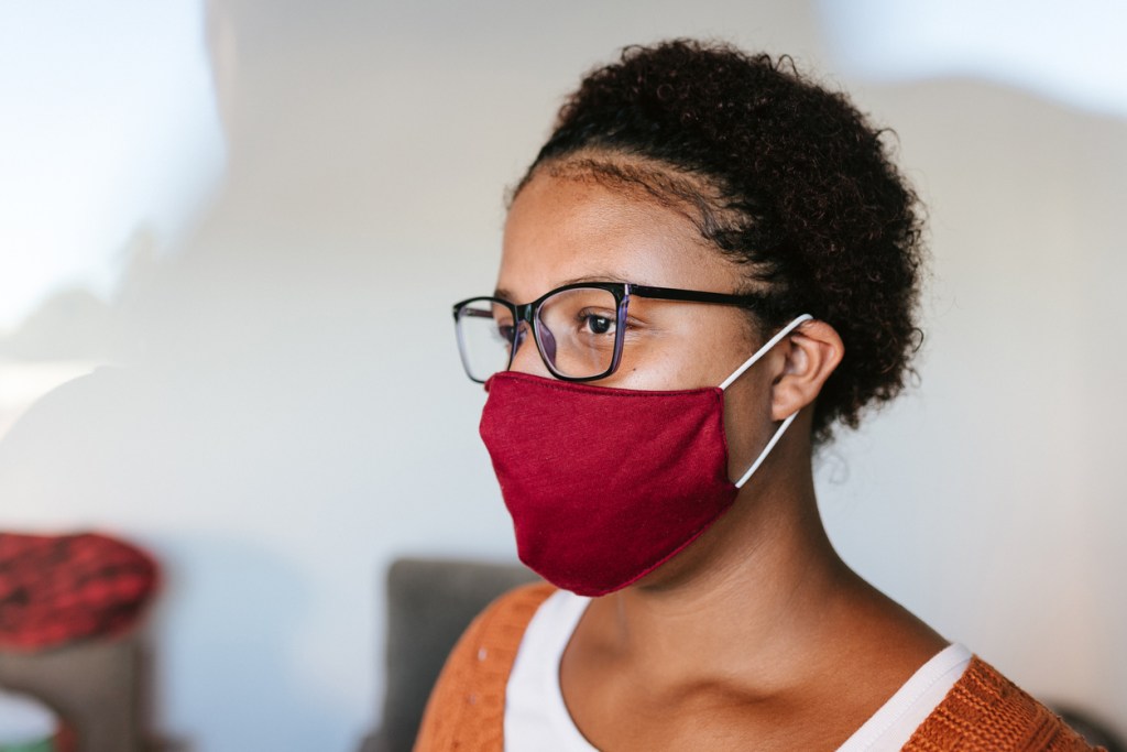 woman-in-profile-wearing-red-hypoallergenic-mask-during-coronavirus-pandemic